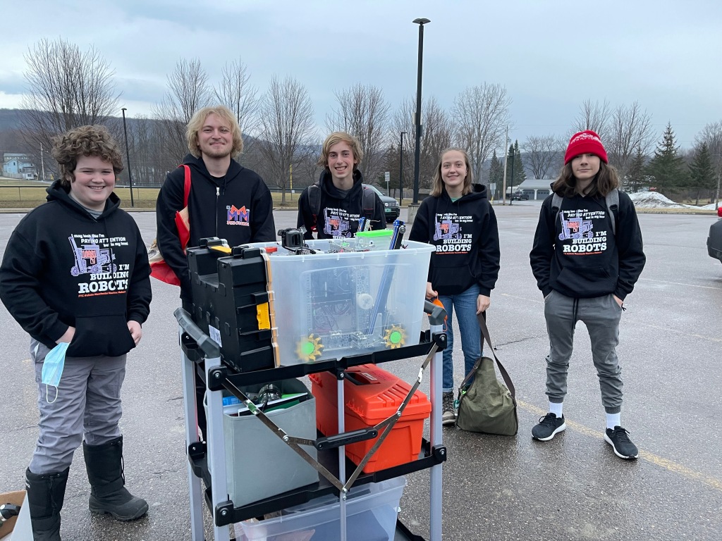 Early morning arrival at the Vermont State FTC Championship, March 19, 2022.  Left to right: Zach, Jacob, Isaac, Charlotte, Takoda.  Photo credit: Coach Meg.