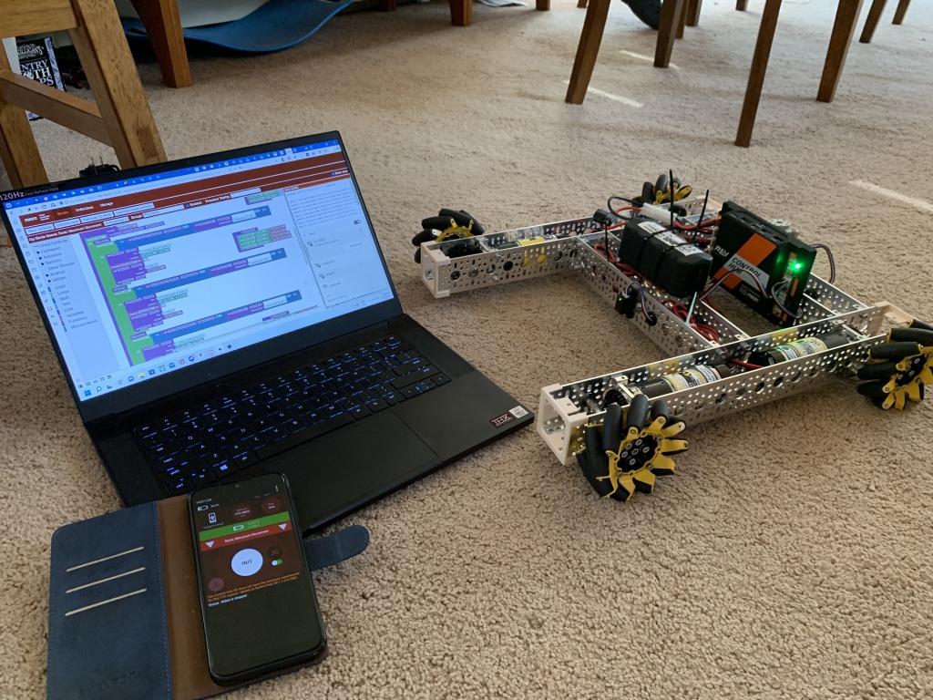 The driver's station, a laptop with Blocks, and the navigation robot.